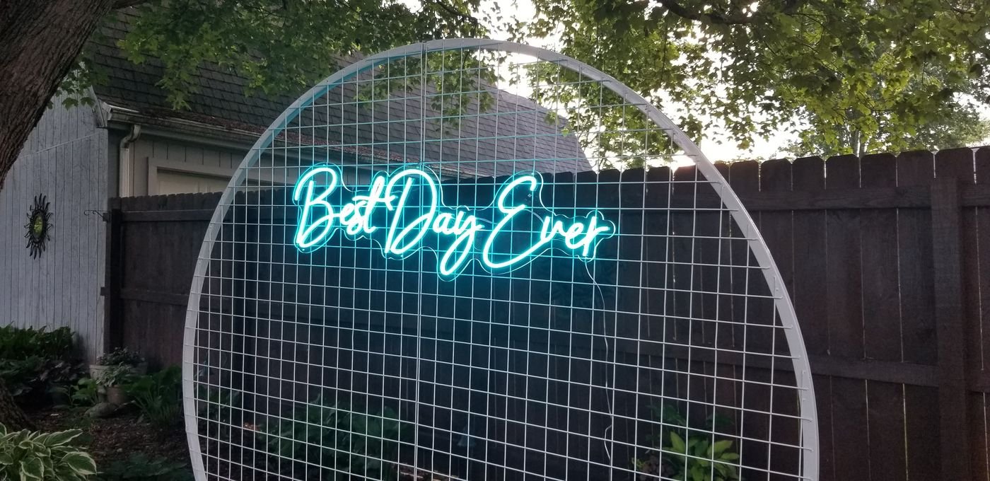 Round wedding backdrop frame with Best Day Ever neon sign