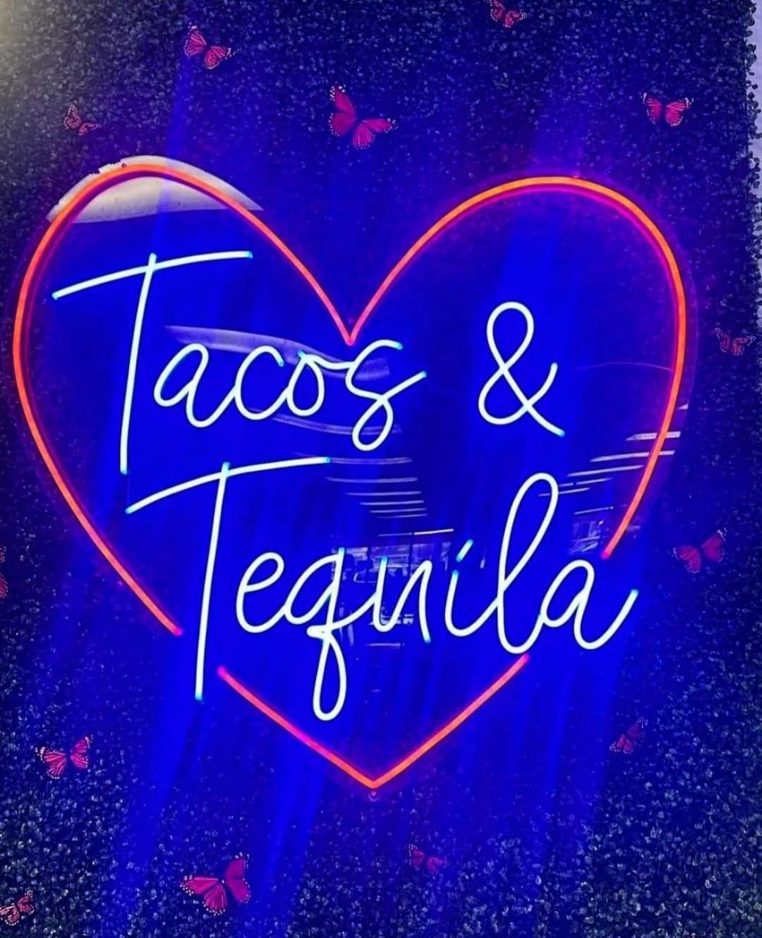 Fun neon heart sign reading Tacos and Tequila, showing Ruby Red Rentals decor works beyond weddings